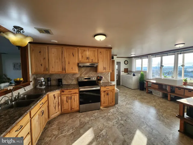 a view of house with outdoor space and sitting area