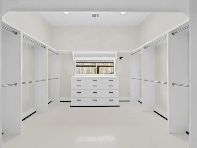 a view of an empty walk in closet