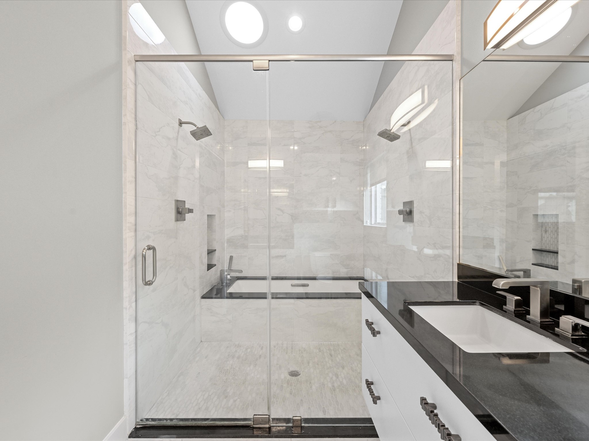 5603 Grape Street Houston, TX 77096 - Photo 26 of 40 a bathroom with a granite countertop shower sink vanity and mirror