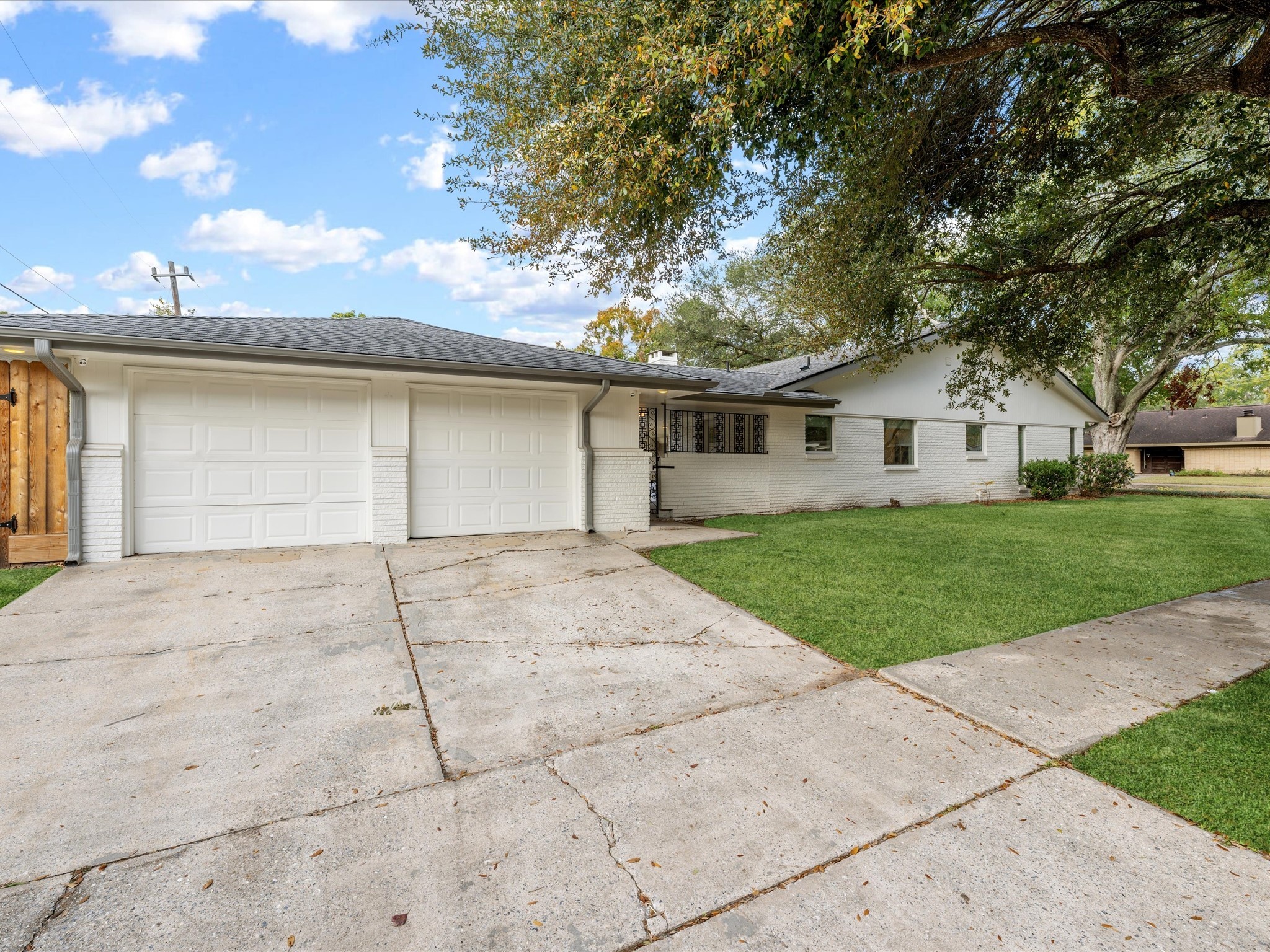 5603 Grape Street Houston, TX 77096 - Photo 5 of 40 a front view of house with yard and green space