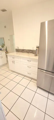 a kitchen with a cabinets and window