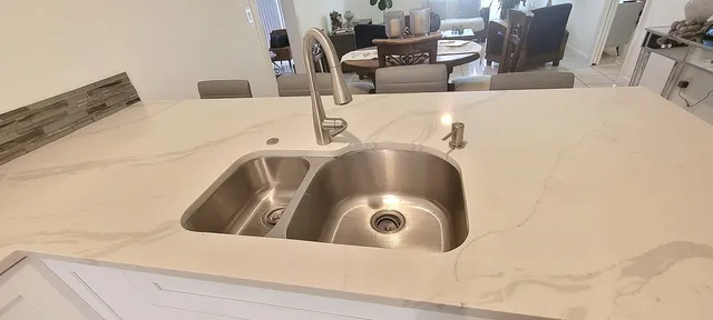 a dining room with table and chairs