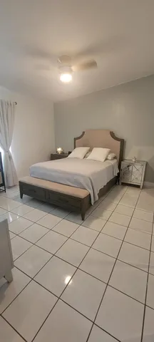 a room with a couch and a stove top oven