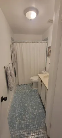 a spacious bedroom with a bed and a window in it