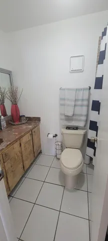 a bedroom with bed and a couch