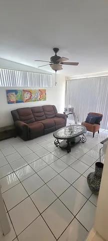 a kitchen with a sink and a stove top oven