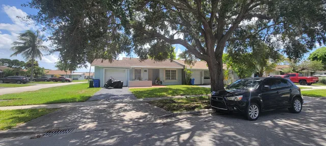a view of a swimming pool with a table and chairs