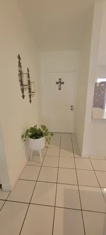 a room with a sink a rug and a stove