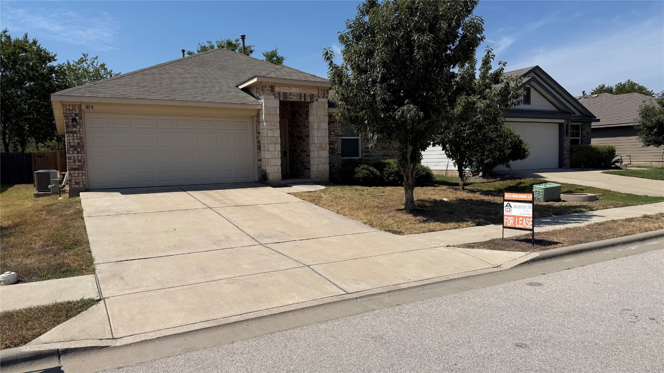 804 Red Tails Drive Austin, TX 78725 - Photo 1 of 14 a front view of a house with street