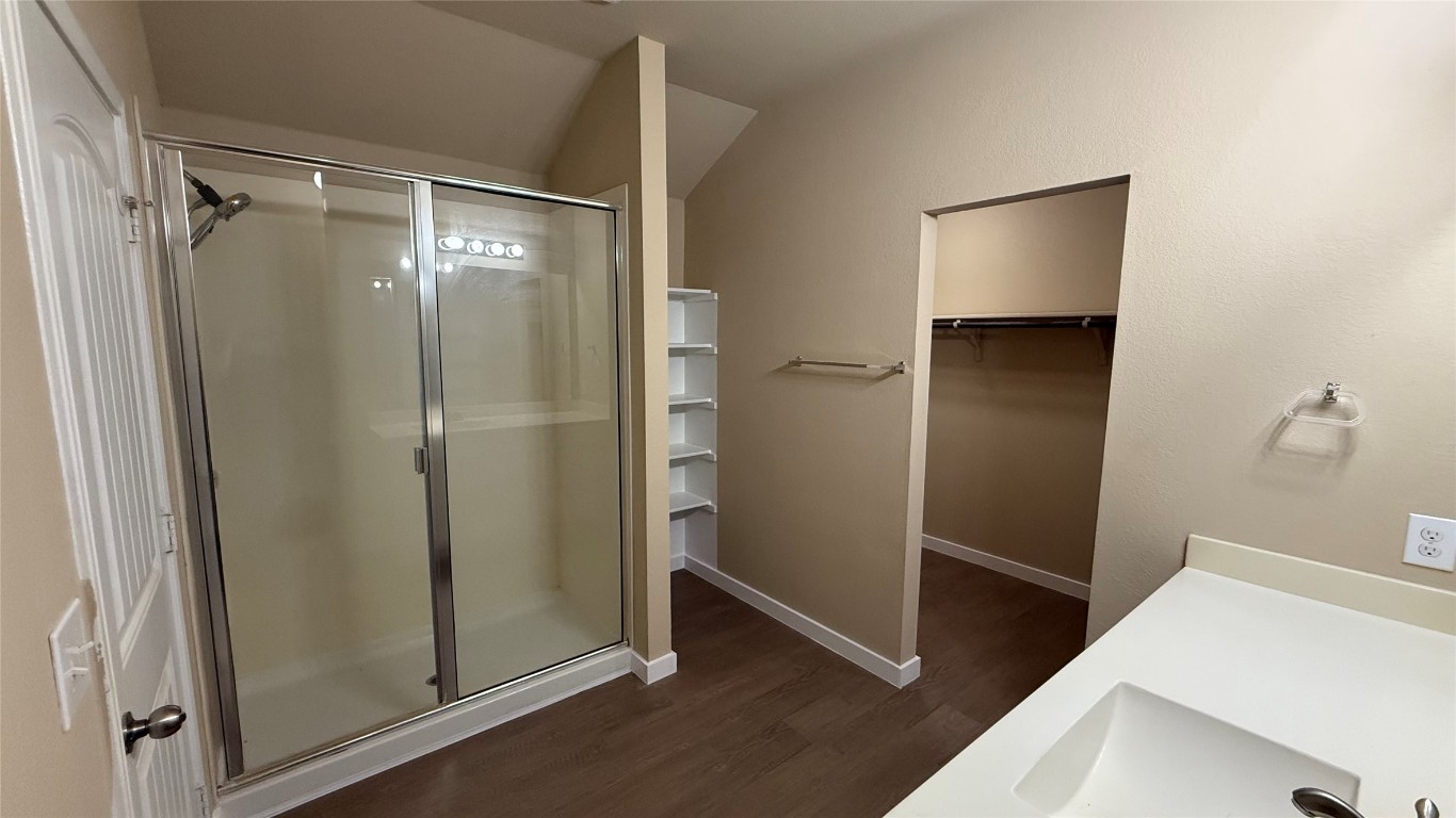 804 Red Tails Drive Austin, TX 78725 - Photo 13 of 14 a bathroom with a shower and a sink