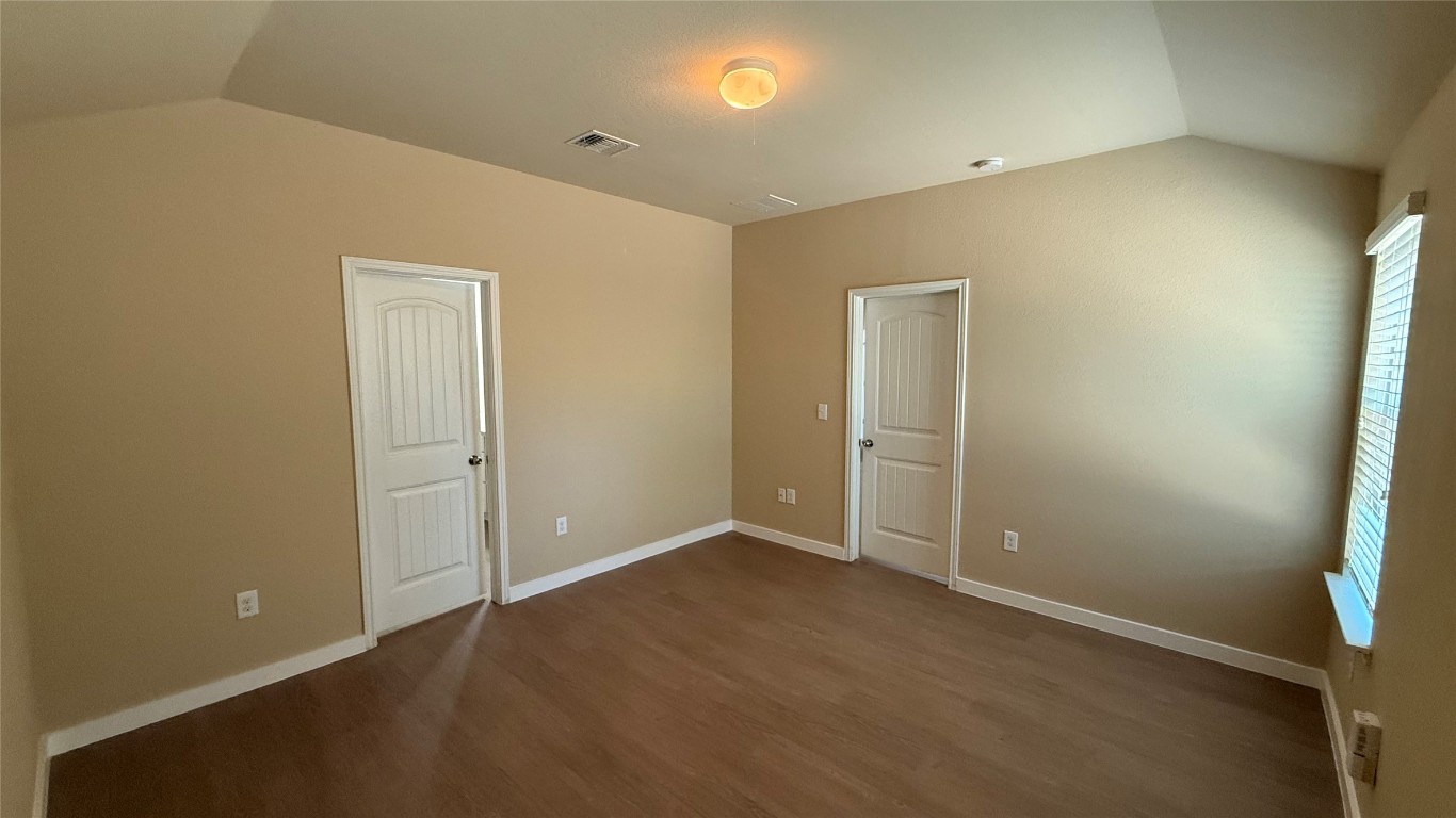 804 Red Tails Drive Austin, TX 78725 - Photo 8 of 14 an empty room with closet area