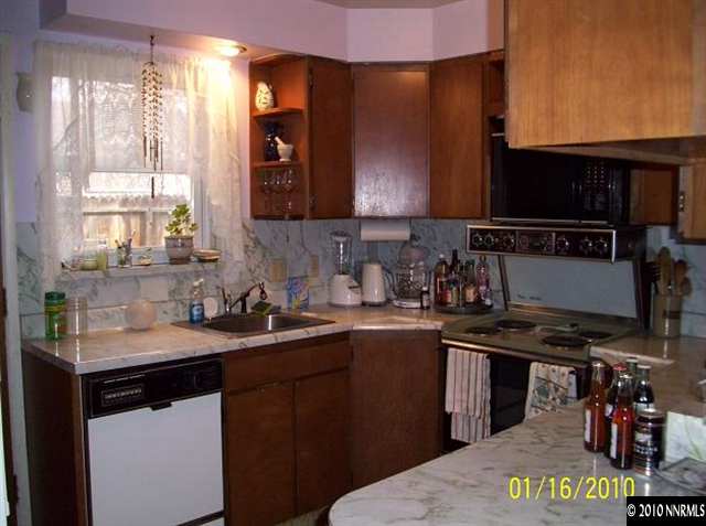 1340 Alturas Avenue Reno, NV 89503 - Photo 2 of 7 a kitchen with a sink and cabinets