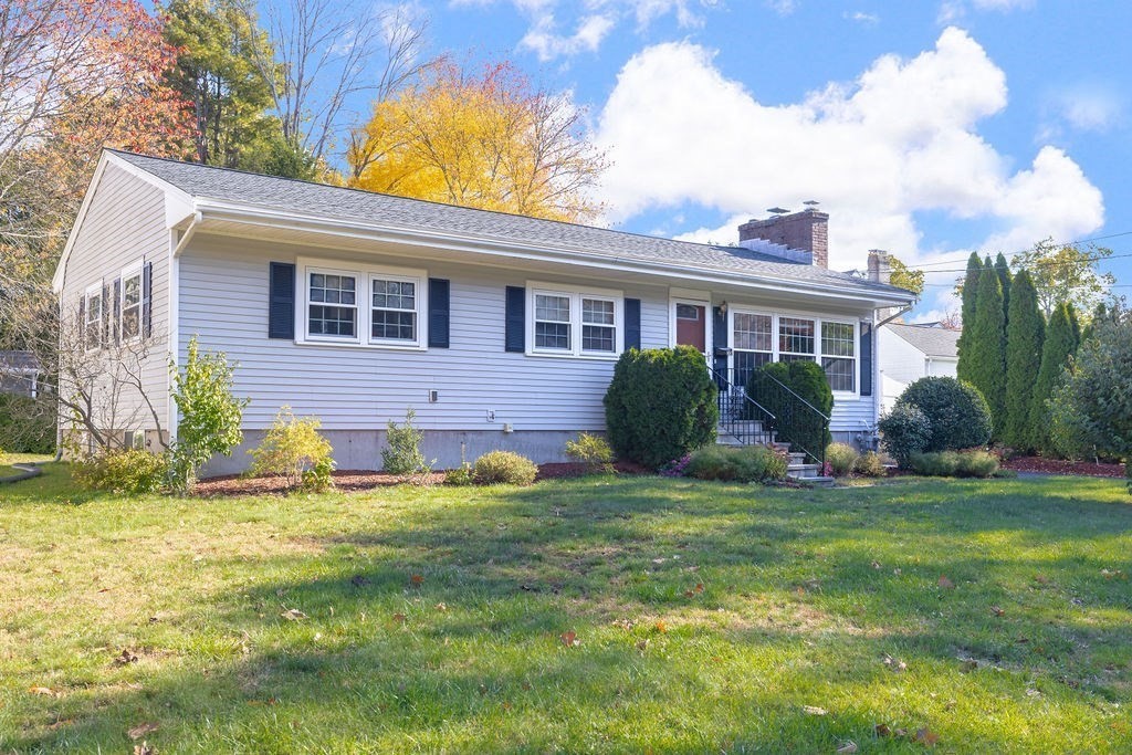 a view of a house with a backyard