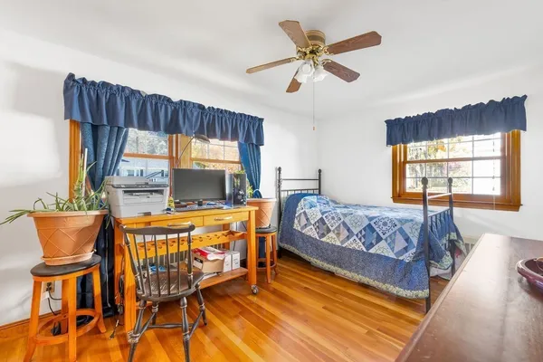 a bed room with a bed and a chair