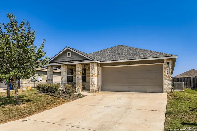 a front view of a house with yard