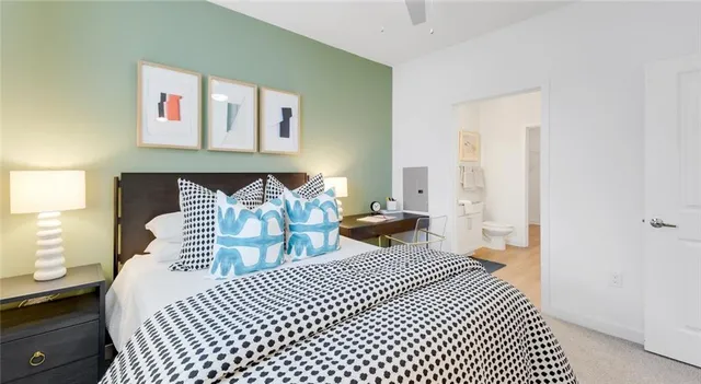 a bedroom with furniture and a wooden floor