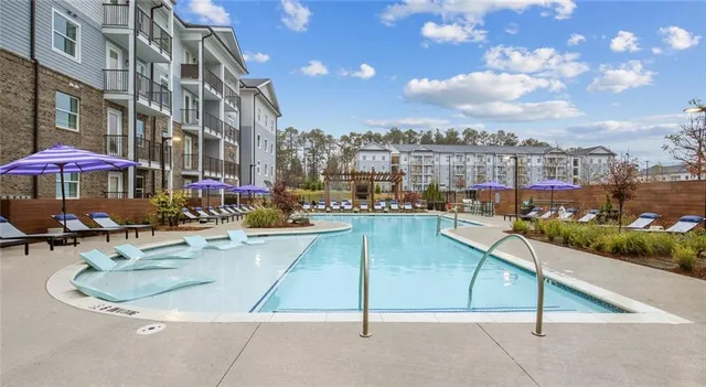 a view of a swimming pool with a patio