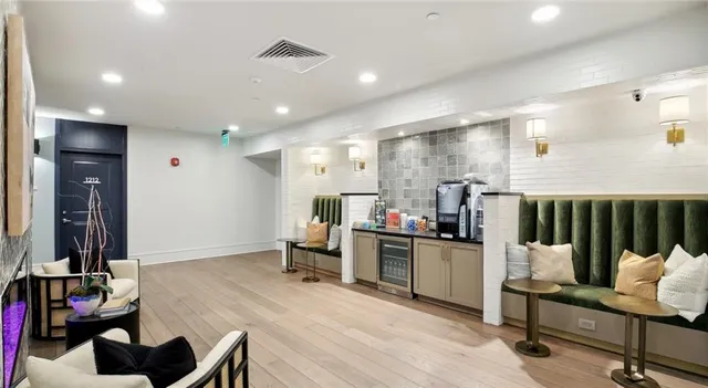 a kitchen with a sink appliances and cabinets