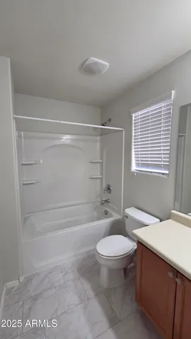 a bathroom with a toilet a sink and bathtub