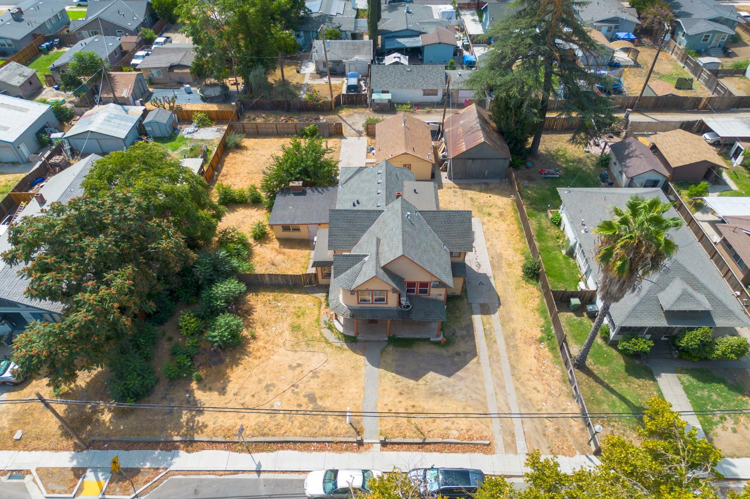 312 West Main Street Turlock, CA 95380 - Photo 3 of 84 an aerial view of a house with a yard and garden