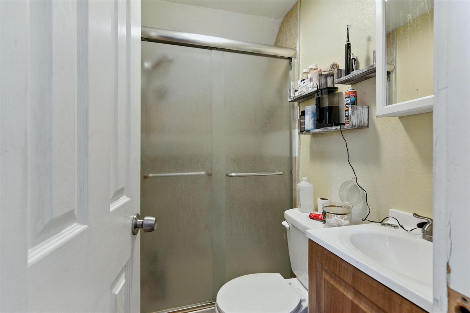 312 West Main Street Turlock, CA 95380 - Photo 40 of 84 a bathroom with a sink toilet and shower