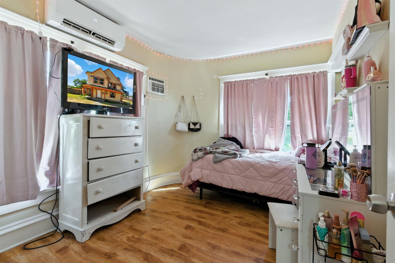 312 West Main Street Turlock, CA 95380 - Photo 46 of 84 a bedroom with a bed and a flat screen tv