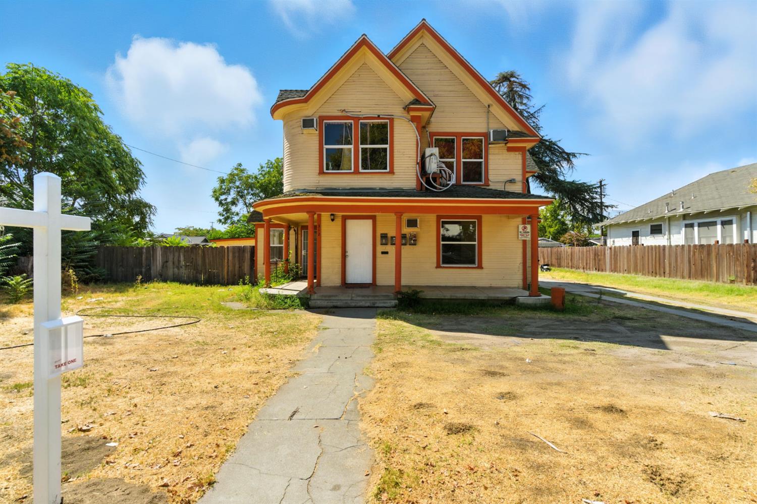 312 West Main Street Turlock, CA 95380 - Photo 6 of 84 a front view of a house with a yard