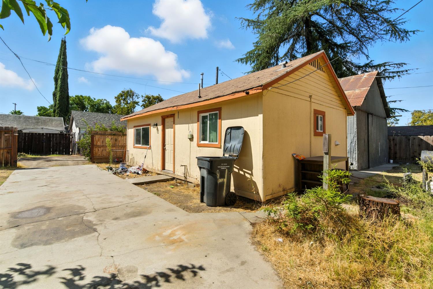 312 West Main Street Turlock, CA 95380 - Photo 65 of 84 a view of a house with backyard and sitting area