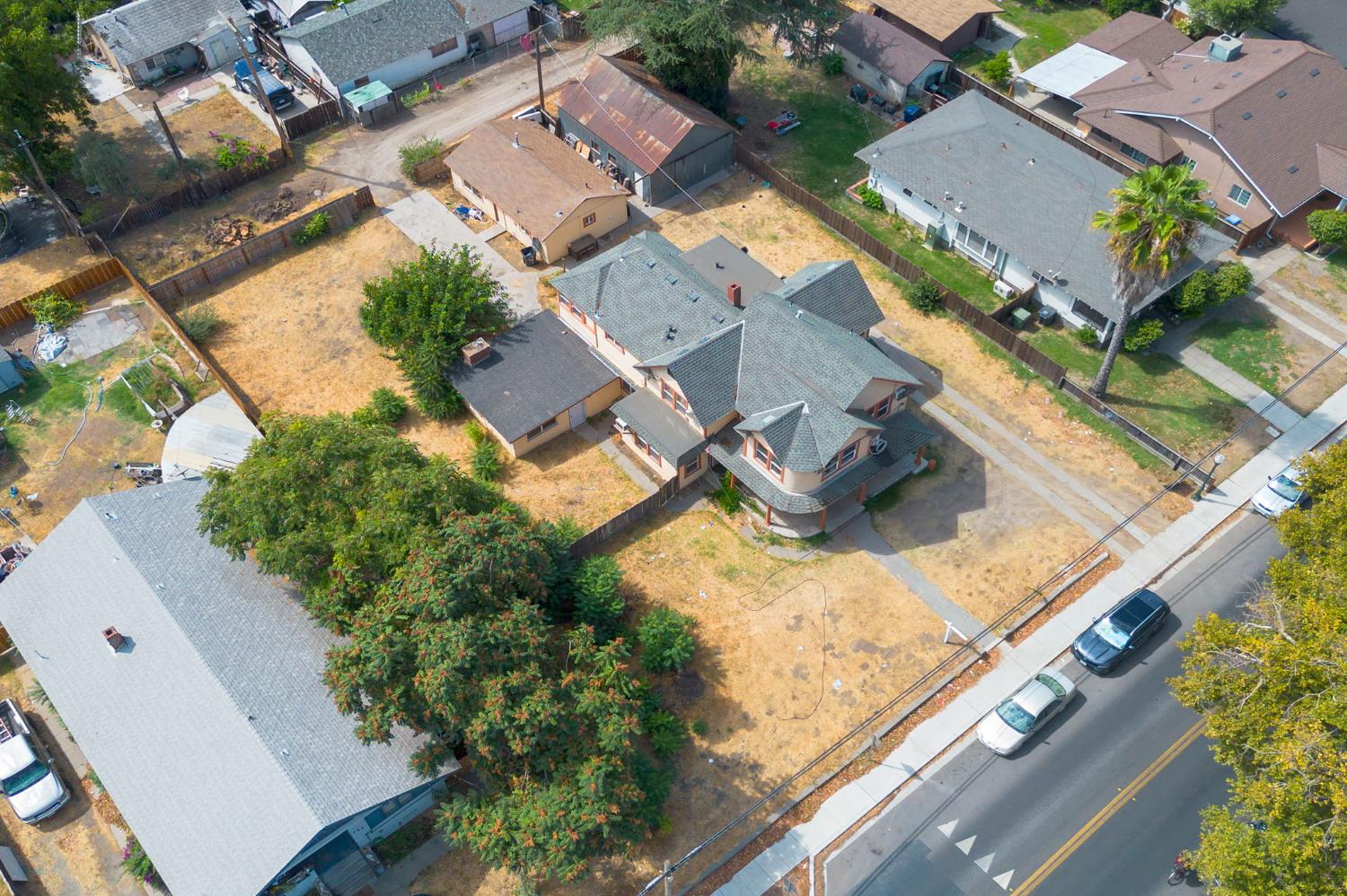 312 West Main Street Turlock, CA 95380 - Photo 70 of 84 an aerial view of residential houses with outdoor space