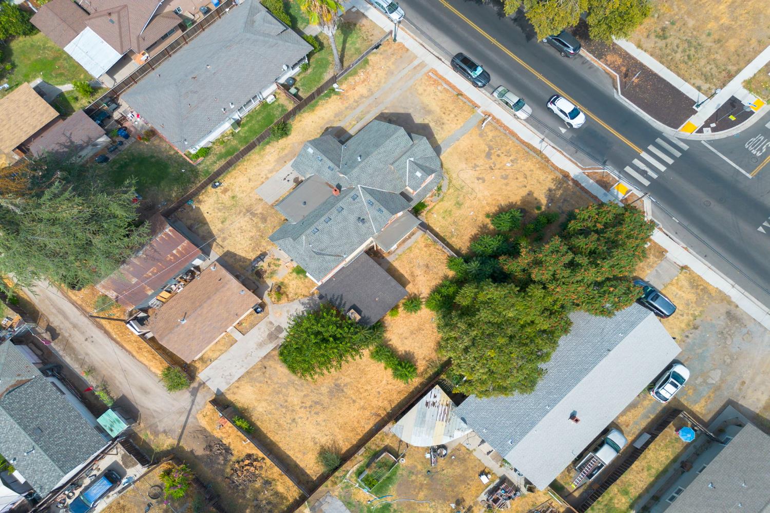 312 West Main Street Turlock, CA 95380 - Photo 71 of 84 an aerial view of a house with a yard and trees