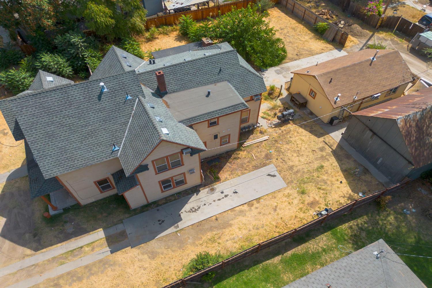 312 West Main Street Turlock, CA 95380 - Photo 79 of 84 an aerial view of a house with a yard