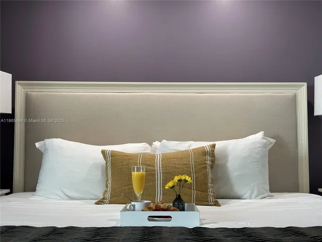 a spacious bathroom with a double vanity sink and a mirror