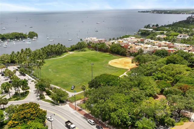 an aerial view of a residential houses with outdoor space