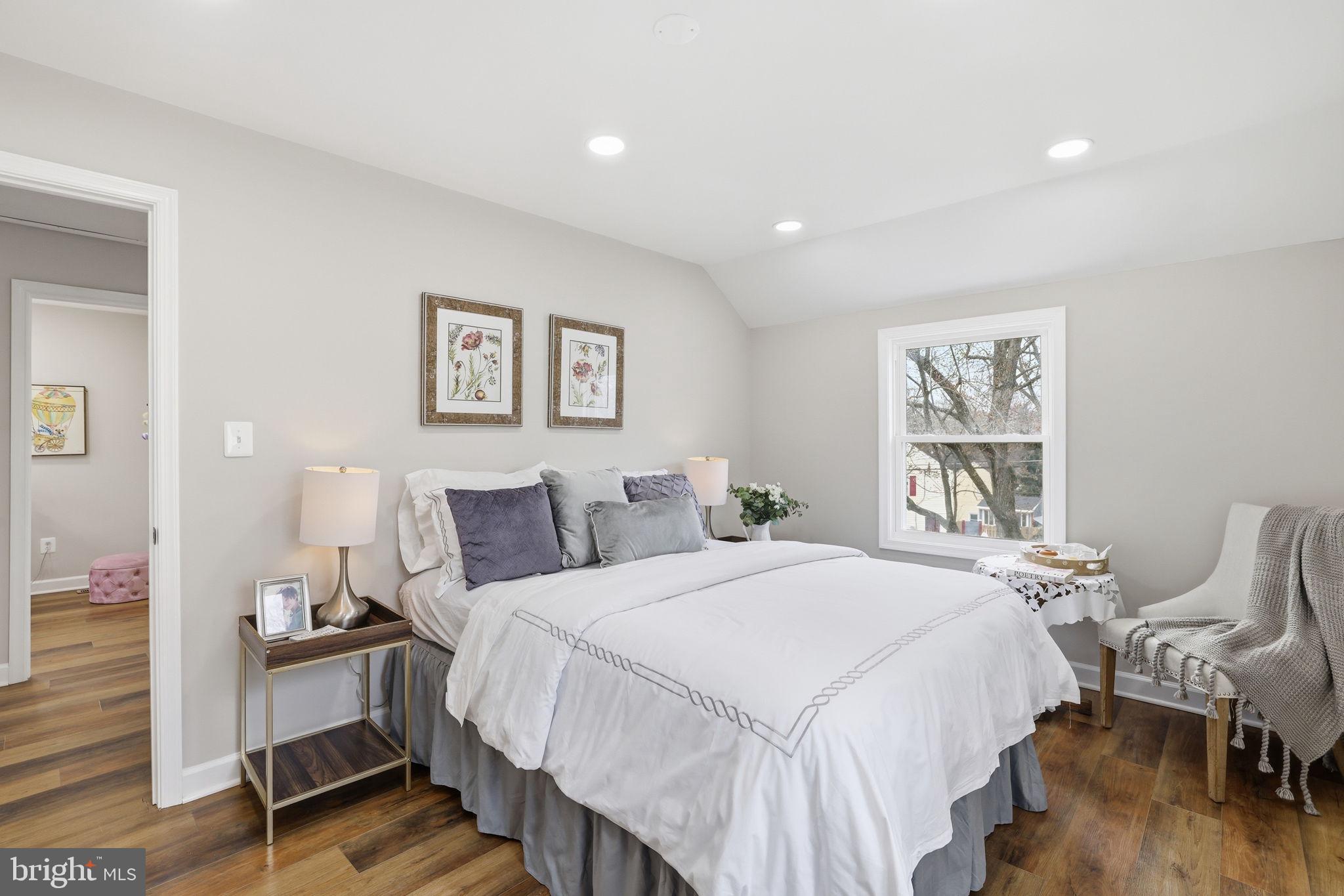 2403 Greeley Place Landover, MD 20785 - Photo 15 of 39 a bedroom with a bed and wooden floor