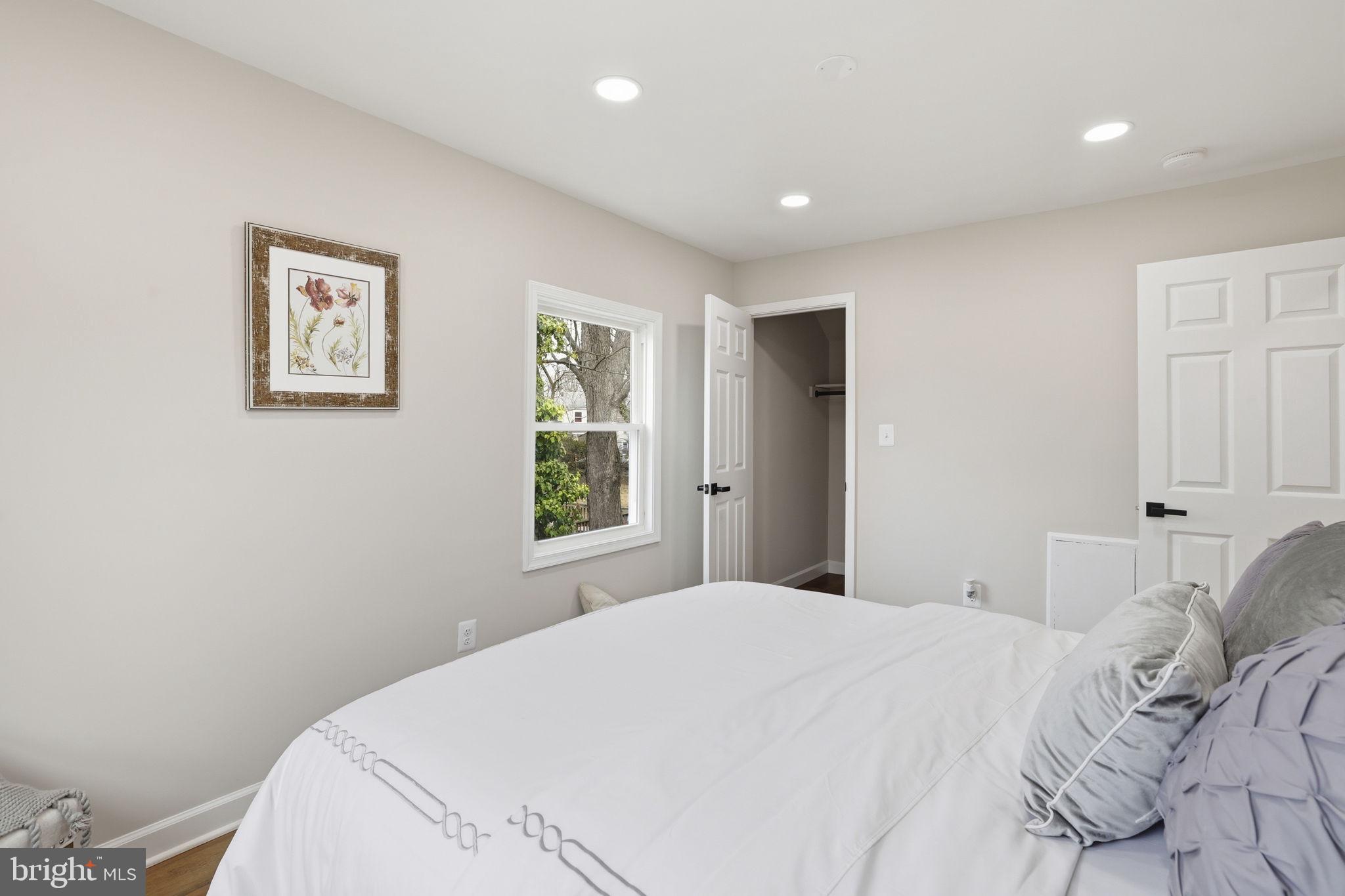2403 Greeley Place Landover, MD 20785 - Photo 16 of 39 a bedroom with a large bed and a window