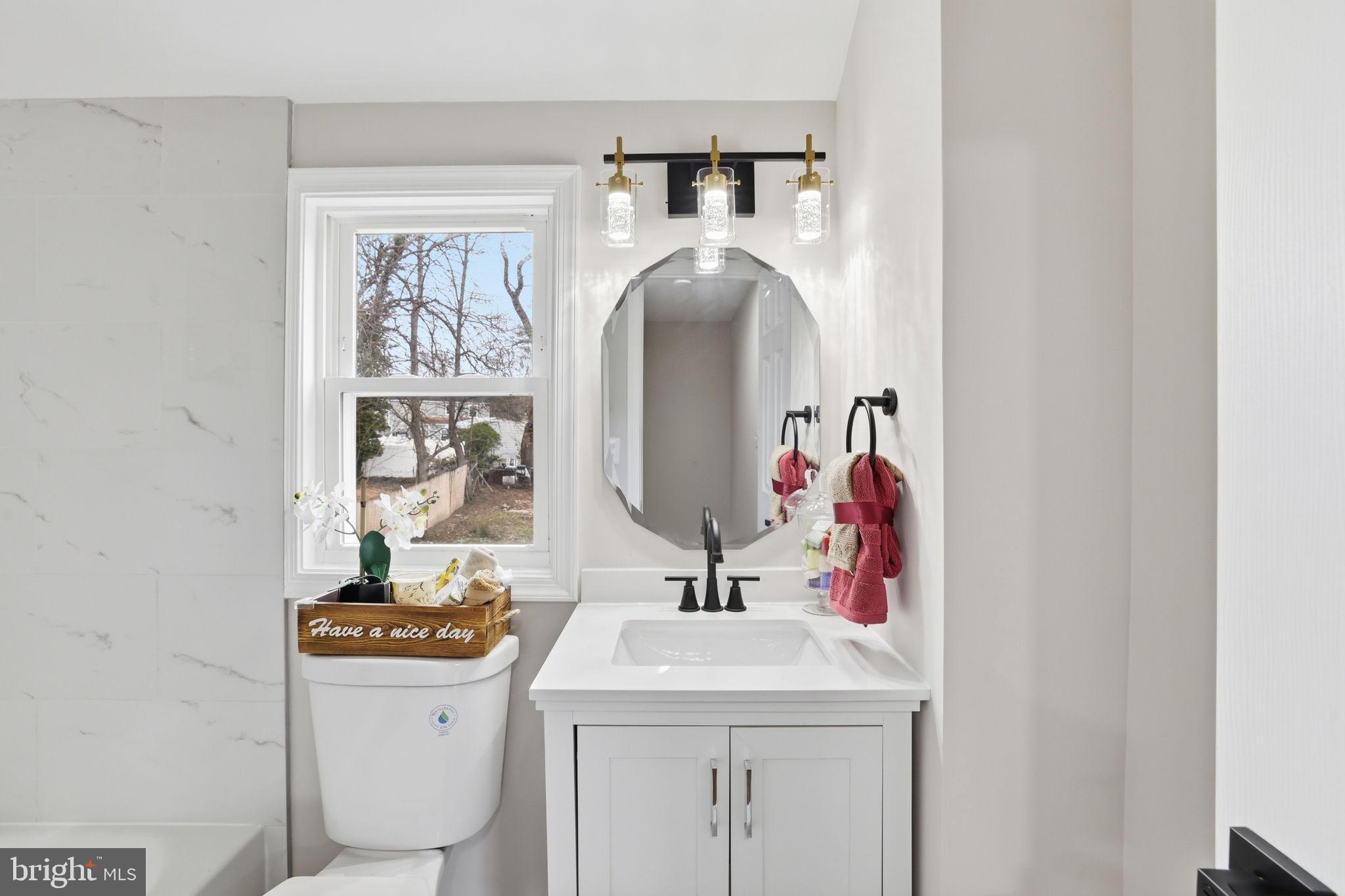 2403 Greeley Place Landover, MD 20785 - Photo 20 of 39 a bathroom with a sink and a mirror