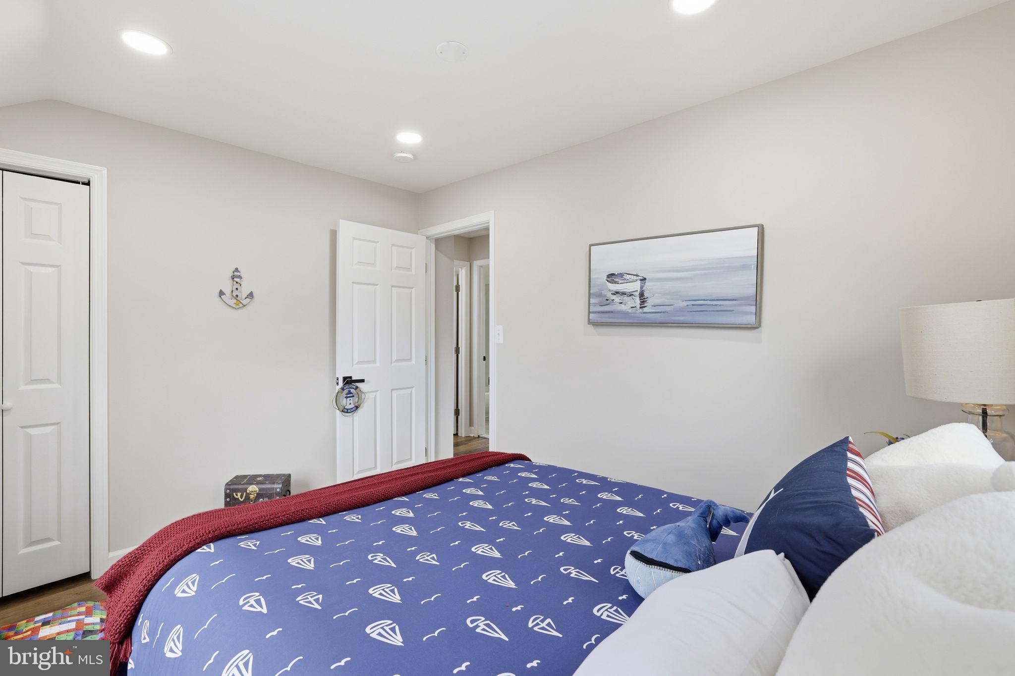 2403 Greeley Place Landover, MD 20785 - Photo 24 of 39 a bedroom with a bed and a couch