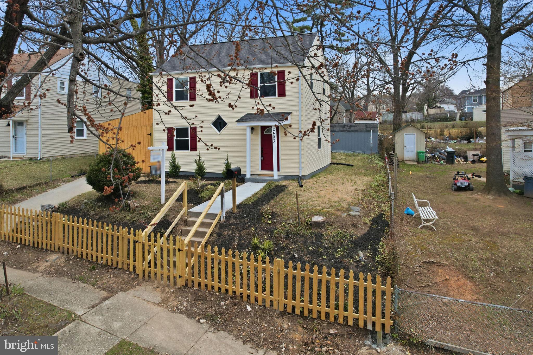 2403 Greeley Place Landover, MD 20785 - Photo 26 of 39 a view of a house with a wooden fence