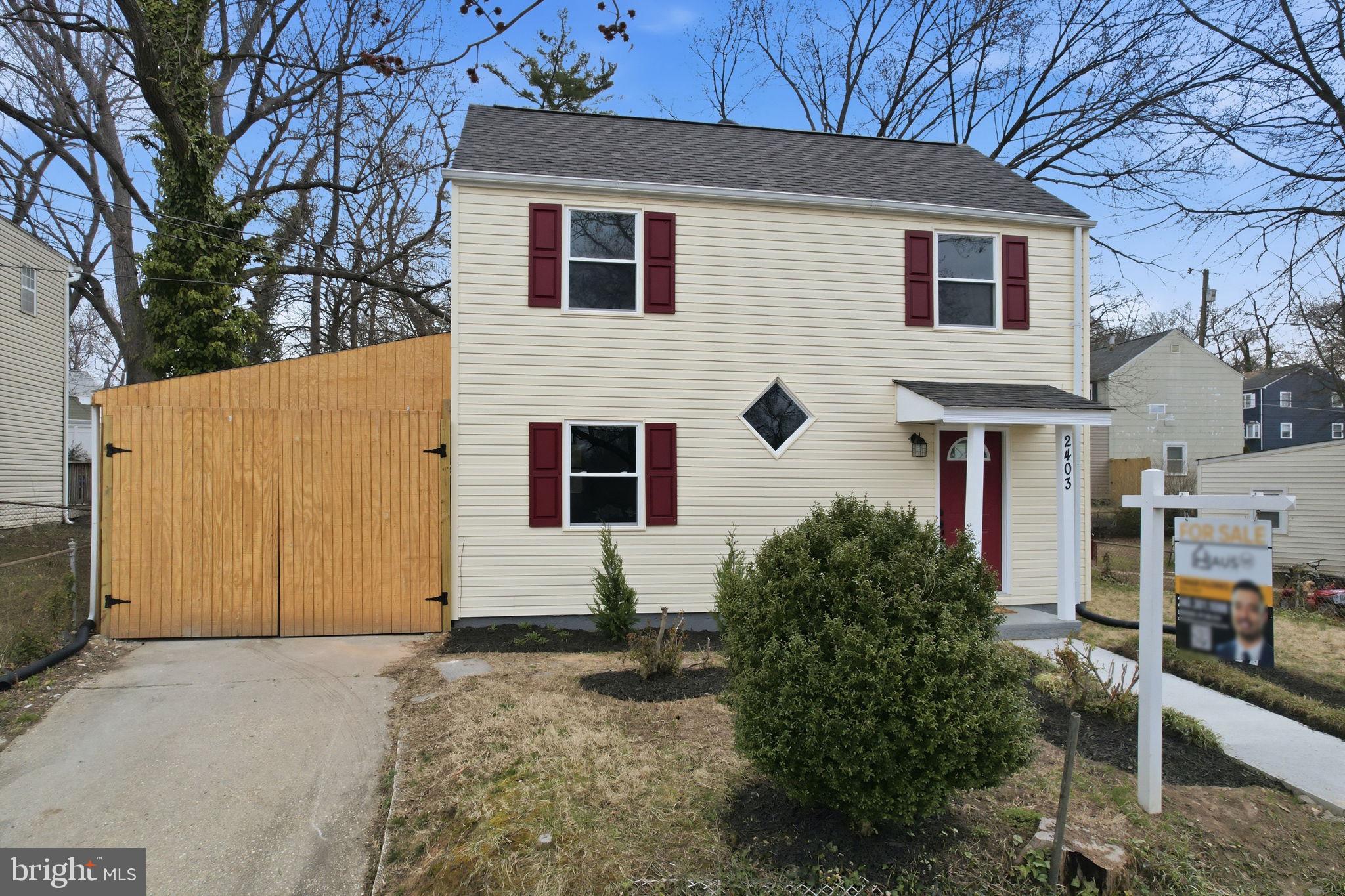 2403 Greeley Place Landover, MD 20785 - Photo 28 of 39 a view of a house with a yard and garage