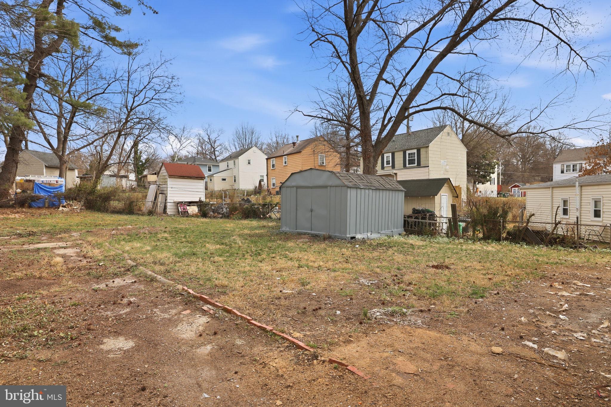 2403 Greeley Place Landover, MD 20785 - Photo 30 of 39 a view of a house with a large tree and a yard