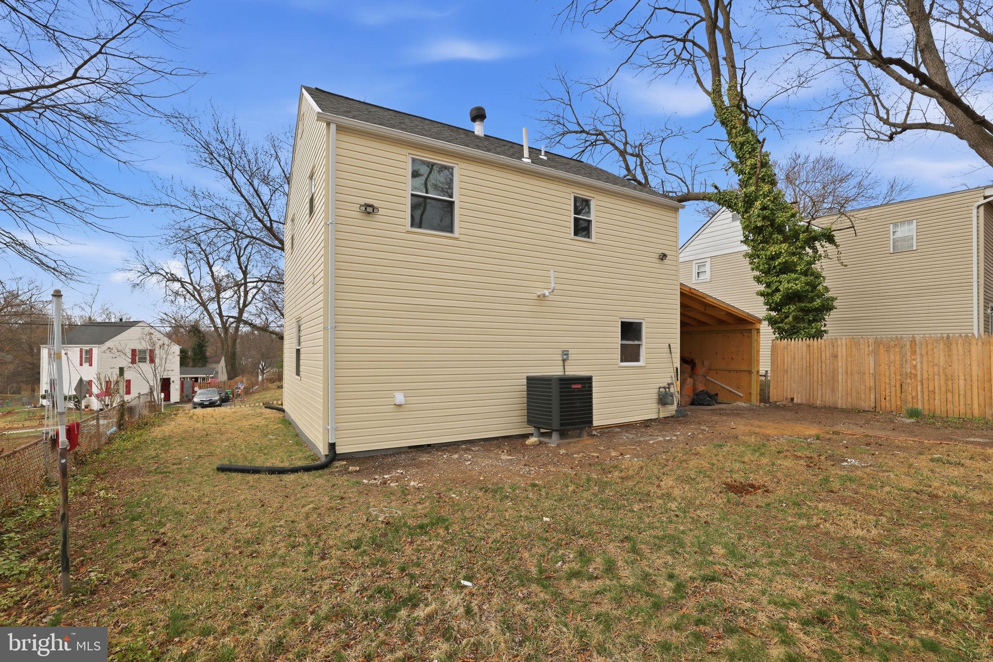 2403 Greeley Place Landover, MD 20785 - Photo 32 of 39 a view of a white house with a yard
