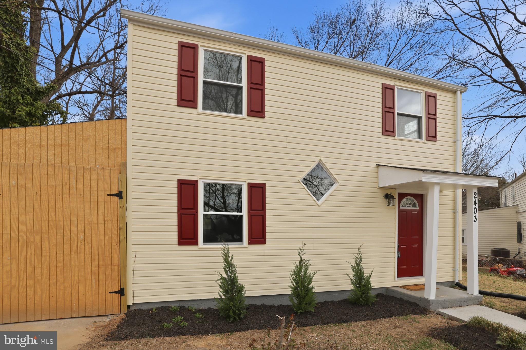 2403 Greeley Place Landover, MD 20785 - Photo 36 of 39 a front view of a house with garden
