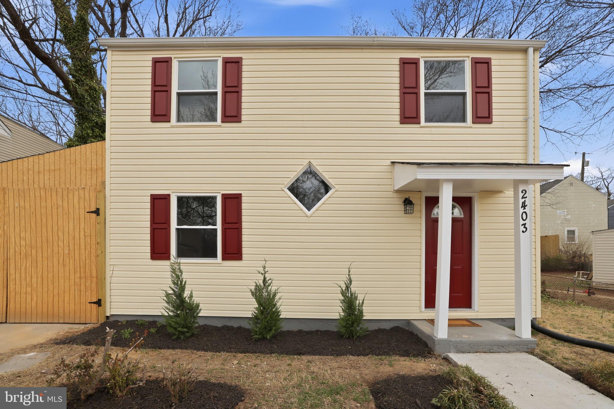 2403 Greeley Place Landover, MD 20785 - Photo 37 of 39 a view of a brick house with many windows