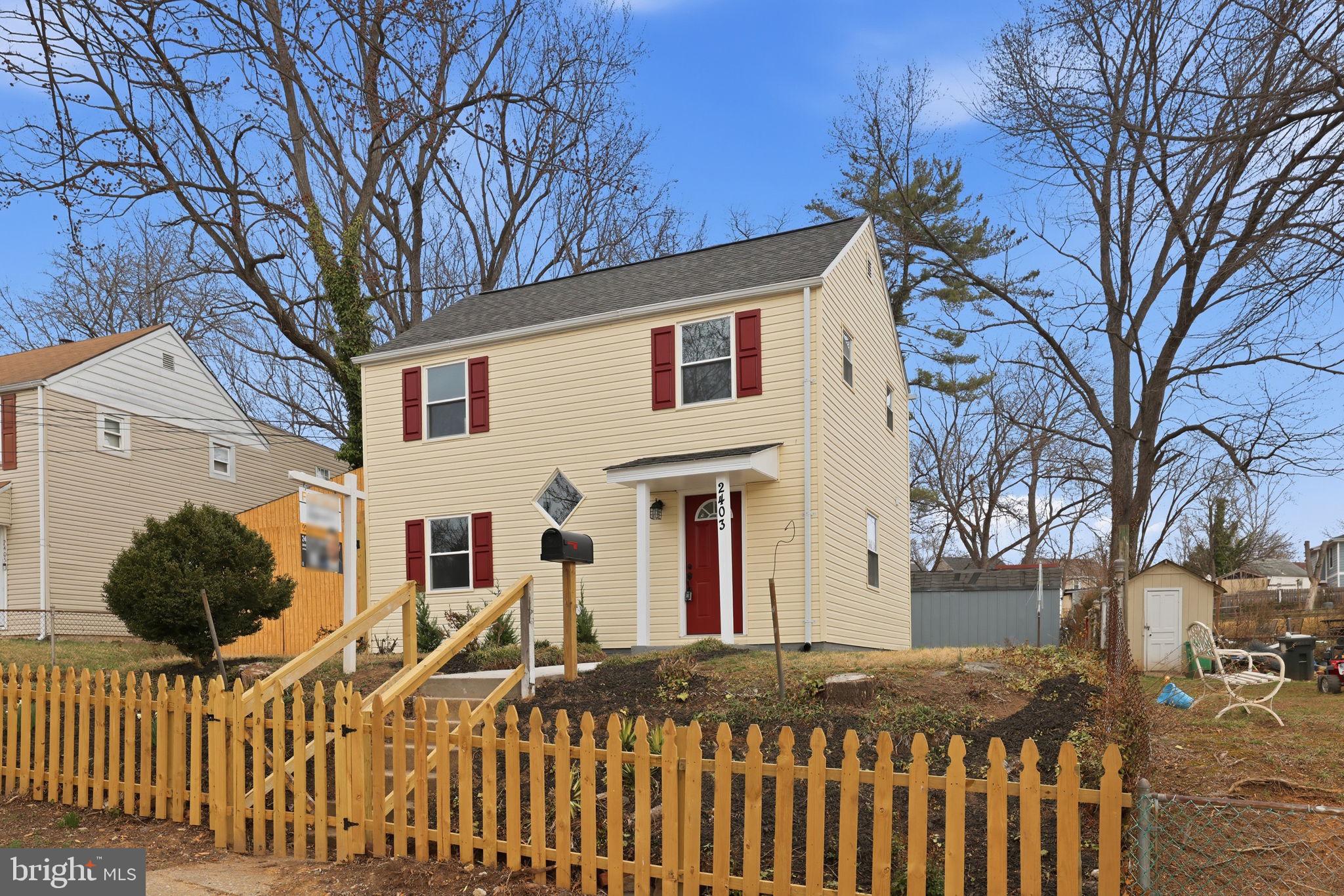 2403 Greeley Place Landover, MD 20785 - Photo 38 of 39 a front view of a house with a yard