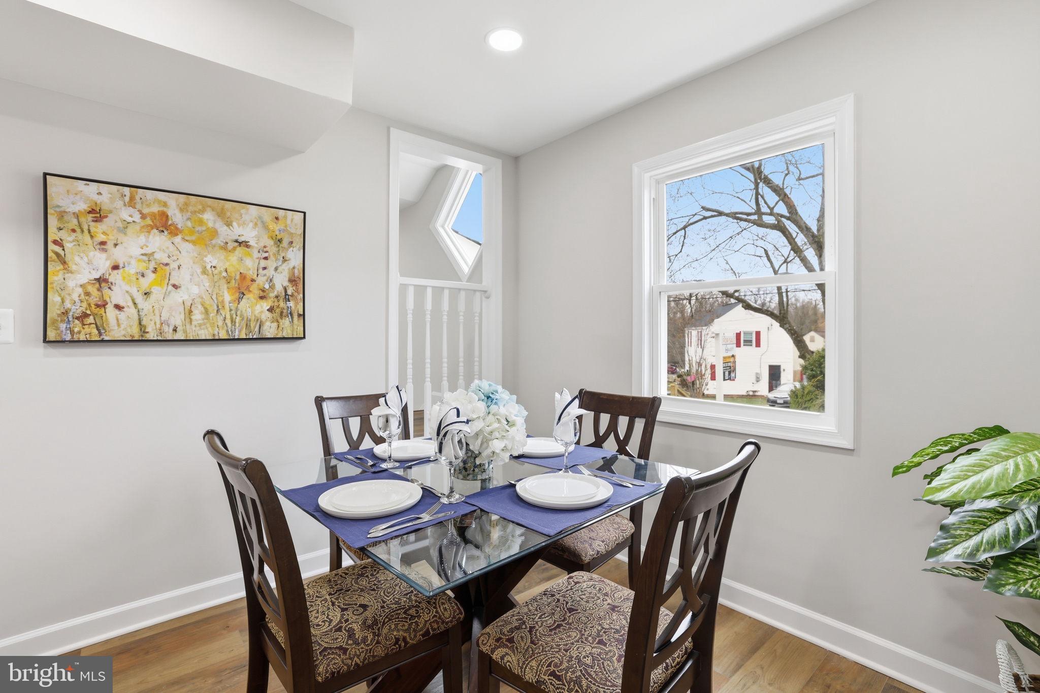 2403 Greeley Place Landover, MD 20785 - Photo 9 of 39 a dining room with furniture and wooden floor
