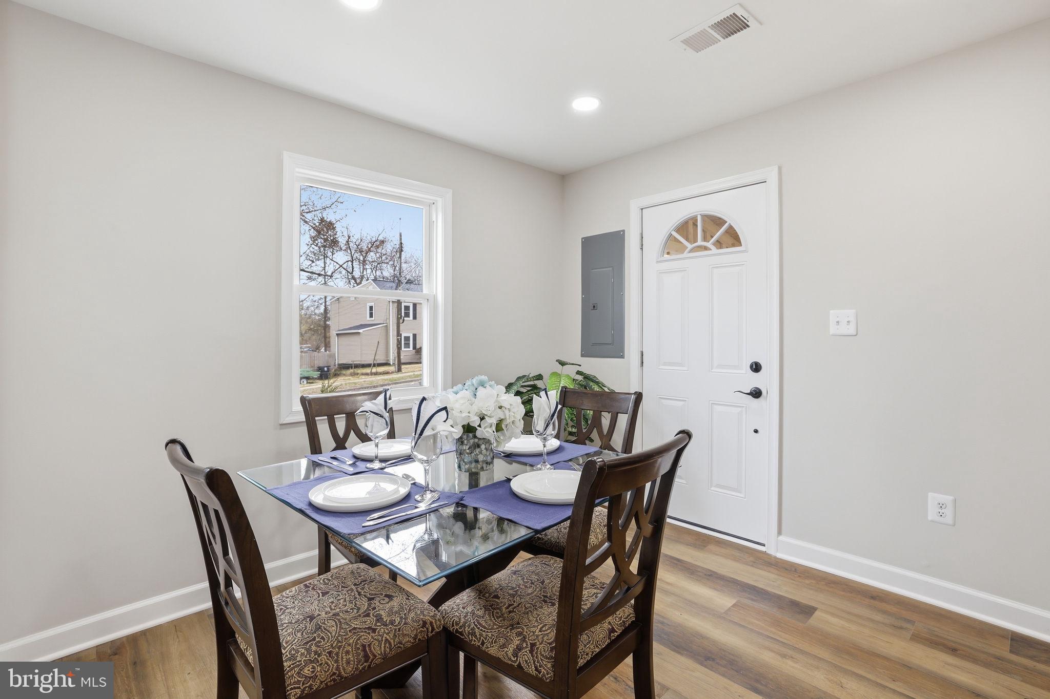 2403 Greeley Place Landover, MD 20785 - Photo 10 of 39 a view of a dining room with furniture and wooden floor