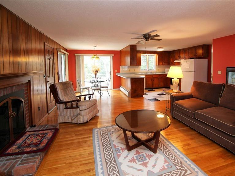 56 James Otis Road Centerville, MA 02632 - Photo 3 of 8 a living room with fireplace furniture and a rug