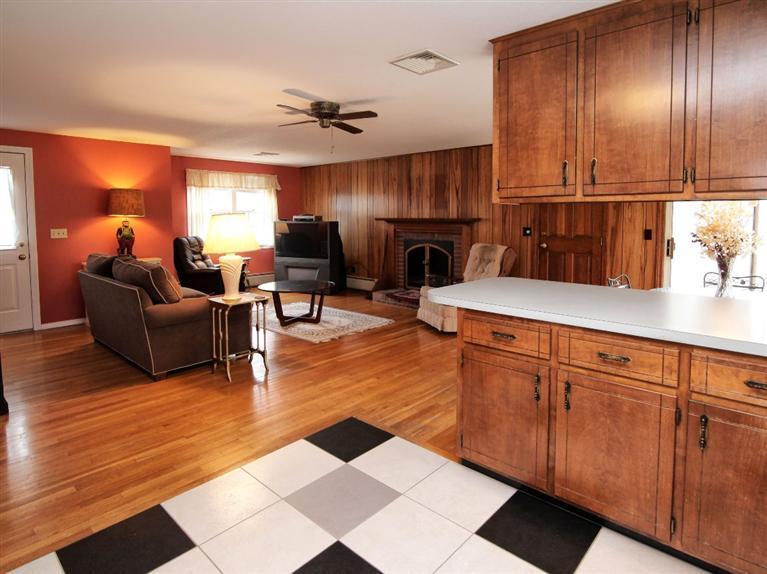 56 James Otis Road Centerville, MA 02632 - Photo 5 of 8 a living room with stainless steel appliances granite countertop furniture wooden floor and a window