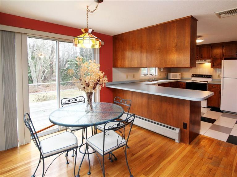 56 James Otis Road Centerville, MA 02632 - Photo 6 of 8 a room with dining table and wooden floor