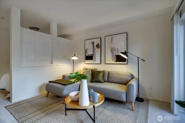 a living room with furniture and a rug